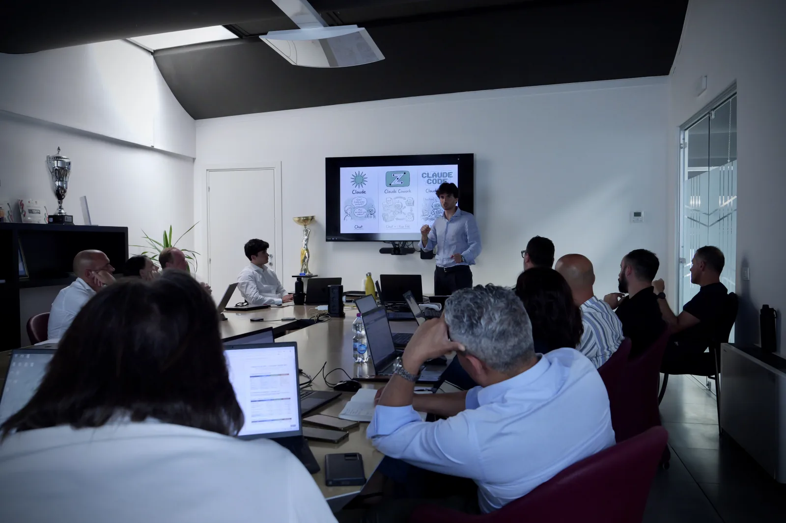 Company meeting room with participants at their laptops during the two days